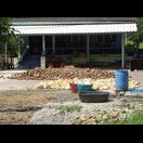 Kautschuk wie er aus den Kokosnussschalen kommt